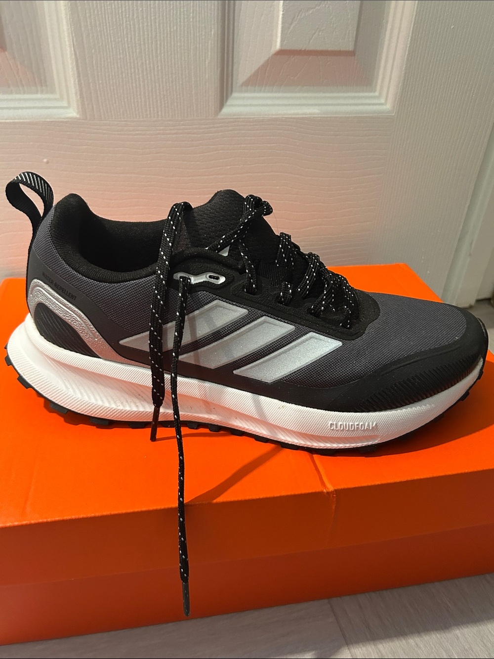 Black Athletic Running Shoe with White Midsole